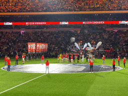 Referees and players entering the pitch at the Philips Stadium, viewed from the Eretribune Noord grandstand, just before the football match PSV - NEC