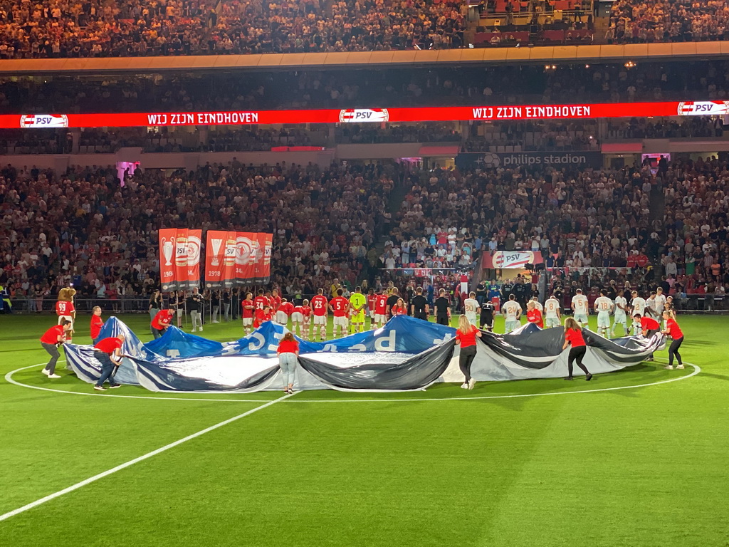 Referees and players on the pitch at the Philips Stadium, viewed from the Eretribune Noord grandstand, just before the football match PSV - NEC