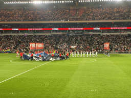 Referees and players on the pitch at the Philips Stadium, viewed from the Eretribune Noord grandstand, just before the football match PSV - NEC