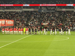 Referees and players on the pitch at the Philips Stadium, viewed from the Eretribune Noord grandstand, just before the football match PSV - NEC