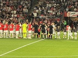 Referees and players on the pitch at the Philips Stadium, viewed from the Eretribune Noord grandstand, just before the football match PSV - NEC