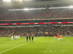 Referees and players keeping 1 minute of silence for disasters in Morocco and Libya on the pitch at the Philips Stadium, viewed from the Eretribune Noord grandstand, just before the football match PSV - NEC