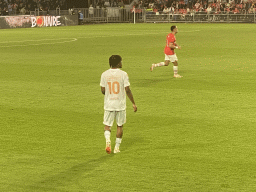 NEC player Sontje Hansen and PSV player Sergiño Dest on the pitch at the Philips Stadium, viewed from the Eretribune Noord grandstand, during the football match PSV - NEC