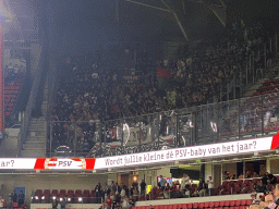 NEC fans at the away grandstand at the Philips Stadium, viewed from the Eretribune Noord grandstand, right after the football match PSV - NEC
