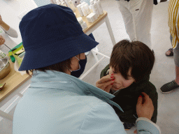 Miaomiao putting Aloe Vera on Max`s face at the main building of the Aloe Vera farm