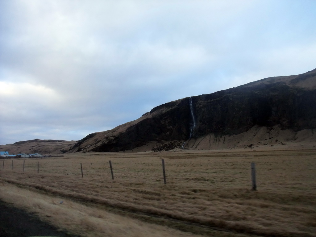 Waterfall on the southwest side of the Eyjafjallajökull volcano, viewed from the rental car to Reykjavik