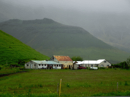 The Nupakot farm and the Eyjafjallajökull volcano, viewed from the parking lot of the Þorvaldseyri visitor centre