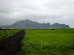 The Hringvegur road and mountains at the southeast side of the Eyjafjallajökull volcano, viewed from the parking lot of the Þorvaldseyri visitor centre