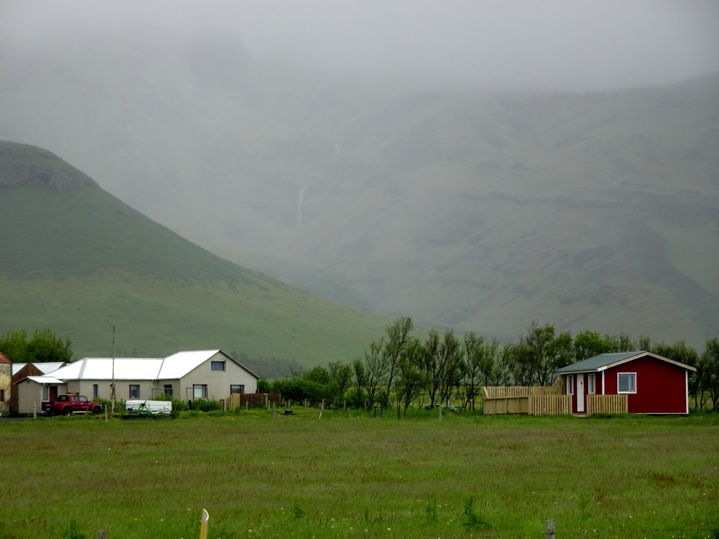 The Nupakot farm and the Eyjafjallajökull volcano, viewed from the parking lot of the Þorvaldseyri visitor centre