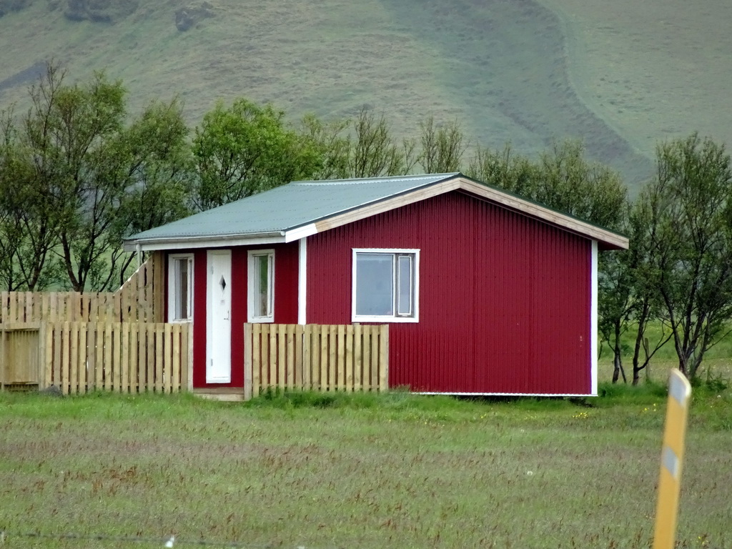 Building of the Nupakot farm in front of the Eyjafjallajökull volcano, viewed from the parking lot of the Þorvaldseyri visitor centre