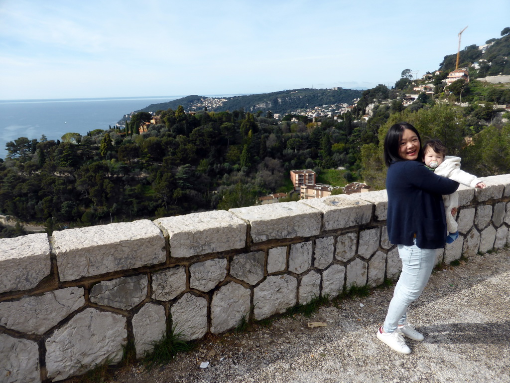 Miaomiao and Max at a a parking place along the Avenue Belle Vista road from Nice, with a view on the Mont Boron hill and part of the town of Villefranche-sur-Mer