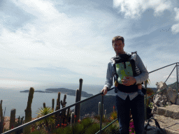 Tim, Max and cactuses at the path at the Jardin d`Èze botanical garden leading to the castle ruins, with a view on the Cap-Ferrat peninsula with the town of Saint-Jean-Cap-Ferrat