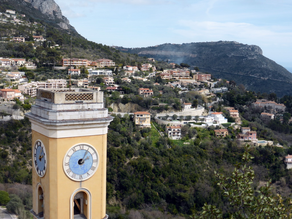 The tower of the Église Notre Dame de l`Assomption church and the northeast side of town, viewed from the castle ruins at the Jardin d`Èze botanical garden