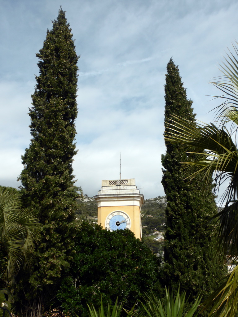 Trees and the tower of the Église Notre Dame de l`Assomption church