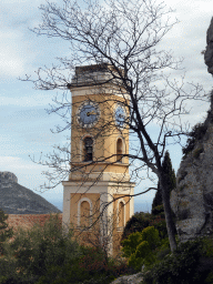 The tower of the Église Notre Dame de l`Assomption church and the northeast side of town, viewed from the Jardin d`Èze botanical garden