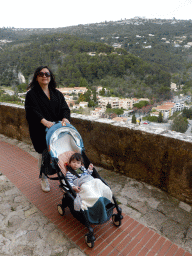 Miaomiao and Max at the Rue de l`Église street, with a view on the north side of town