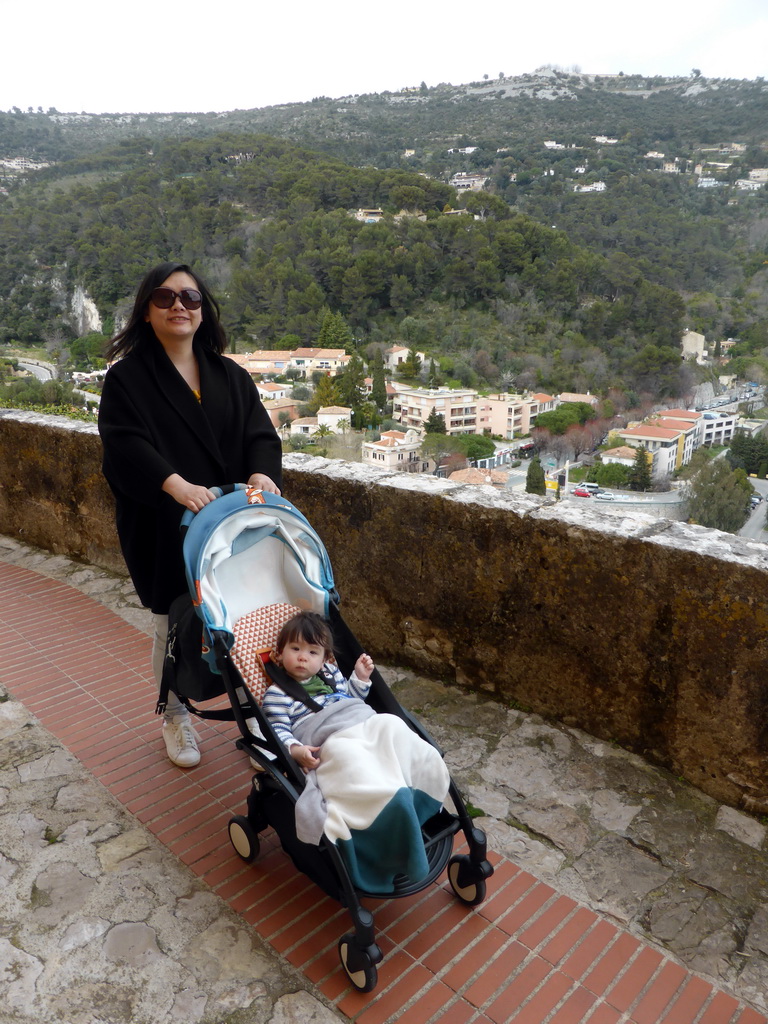 Miaomiao and Max at the Rue de l`Église street, with a view on the north side of town