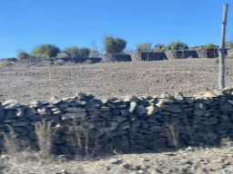 Ancient houses at the Mundo Aborigen theme park, viewed from the tour bus on the GC-60 road