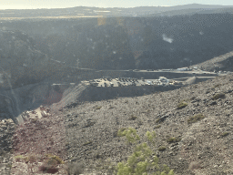 The Barranco de Vicentillos dam at the south side of the Barranco de Fataga ravine, viewed from the tour bus on the GC-60 road