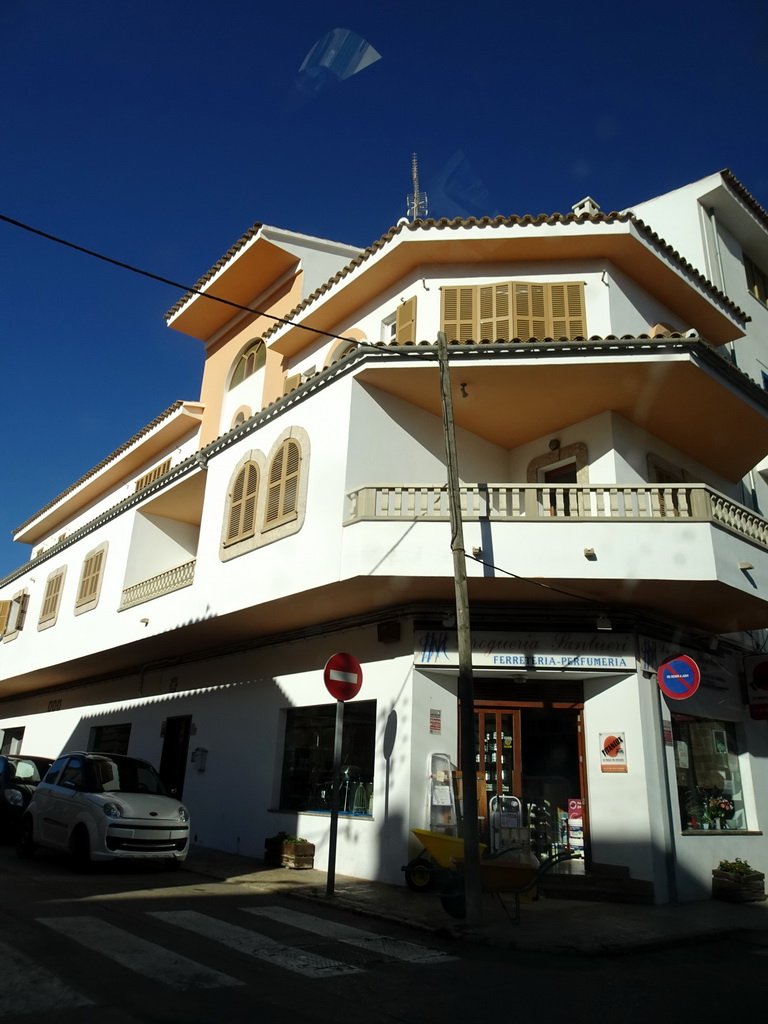 Building on the corner of the Carrer de Santueri and Carrer de l`En Pelat streets, viewed from the rental car