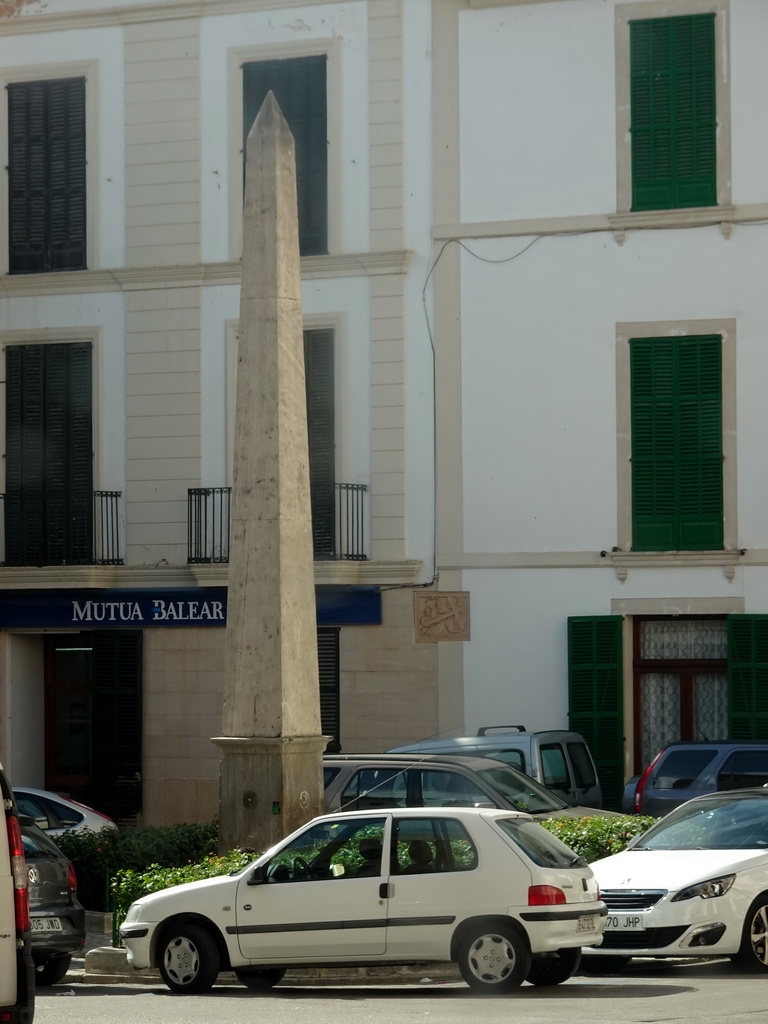 Obelisk at the Plaça Arraval square, viewed from the rental car at the Carrer del Mar street
