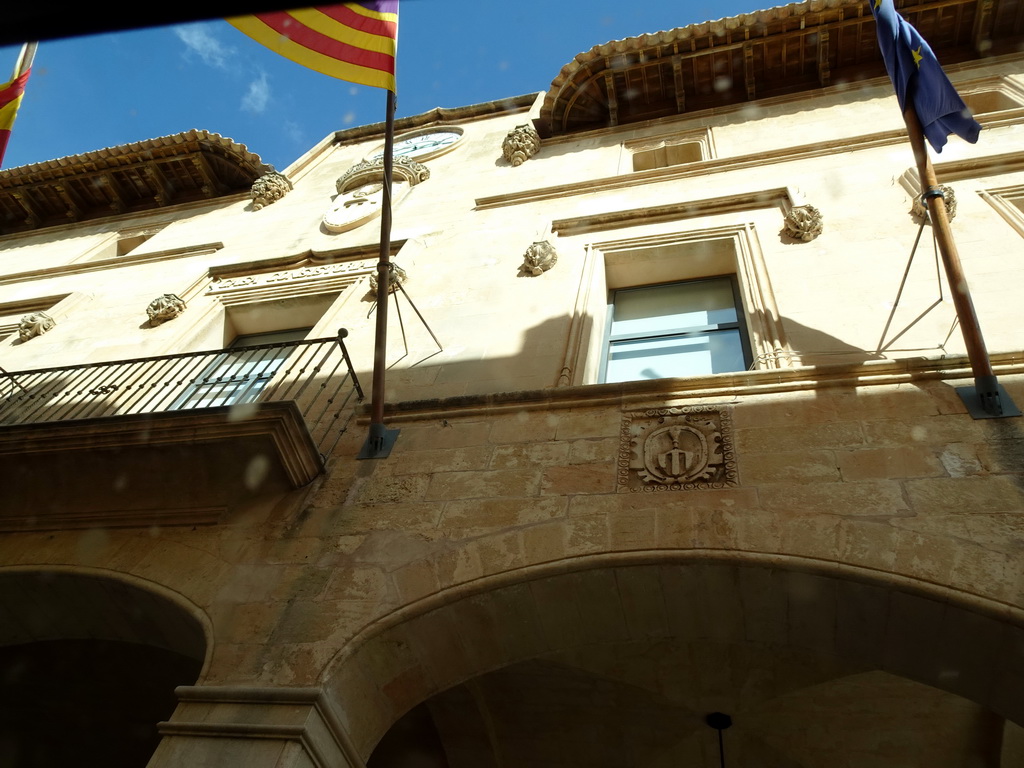 Facade of the Town Hall at the Plaça Constitució square, viewed from the rental car