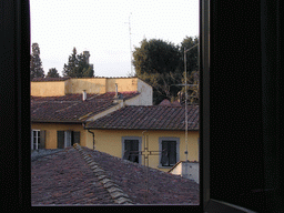 Roof of a church at the Via Romana street, the Torrigiani Tower and houses at the Via Serumido street, viewed from Miaomiao`s room at the La Chicca di Boboli hotel