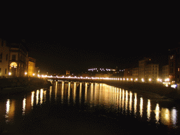 The Ponte alle Grazie bridge over the Arno river, viewed from the Ponte Vecchio bridge, by night