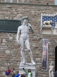 Copy of the statue `David` by Michelangelo in front of the Palazzo Vecchio palace at the Piazza della Signoria square
