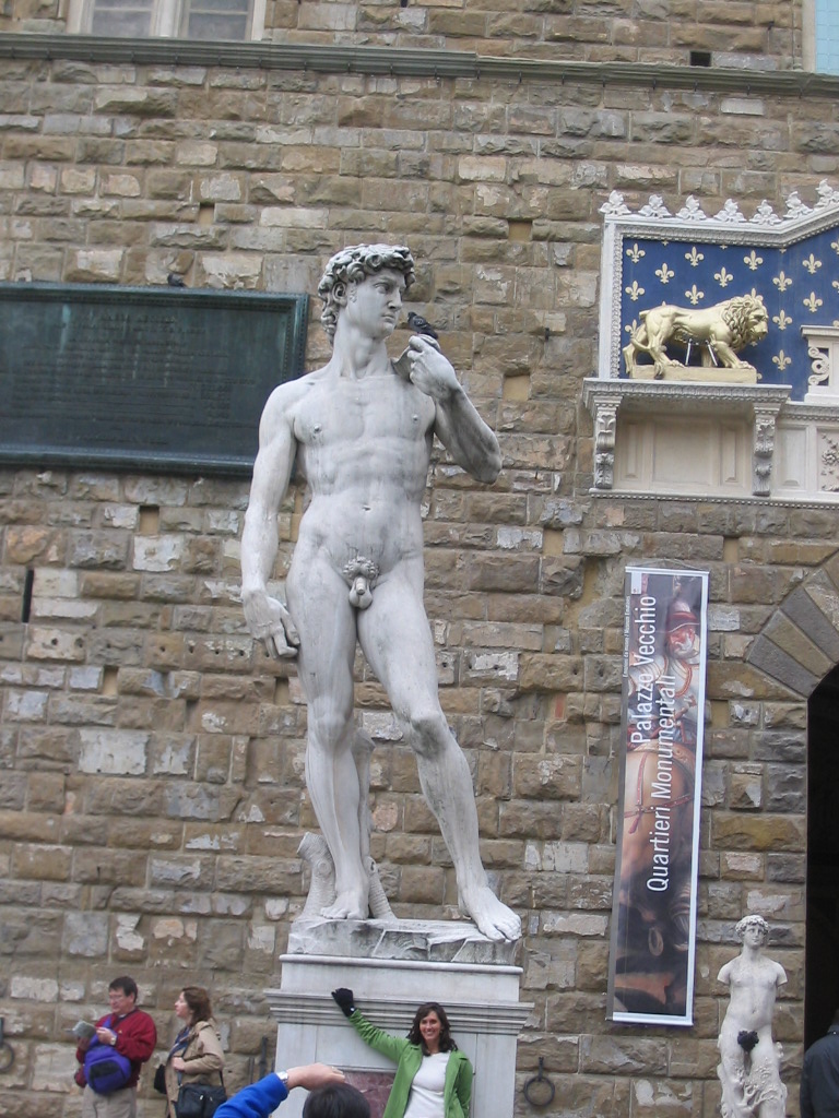 Copy of the statue `David` by Michelangelo in front of the Palazzo Vecchio palace at the Piazza della Signoria square