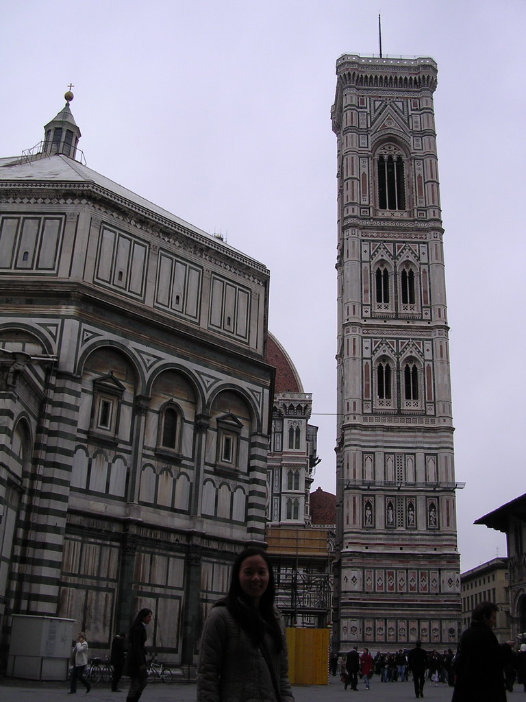 Miaomiao`s friend at the Piazza di San Giovanni square, with a view on the Baptistery of St. John, the Cathedral of Santa Maria del Fiore and the Campanile di Giotto tower