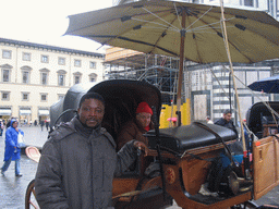 Miaomiao`s friend with a horse and carriage in front of the Baptistery of St. John at the Piazza di San Giovanni square