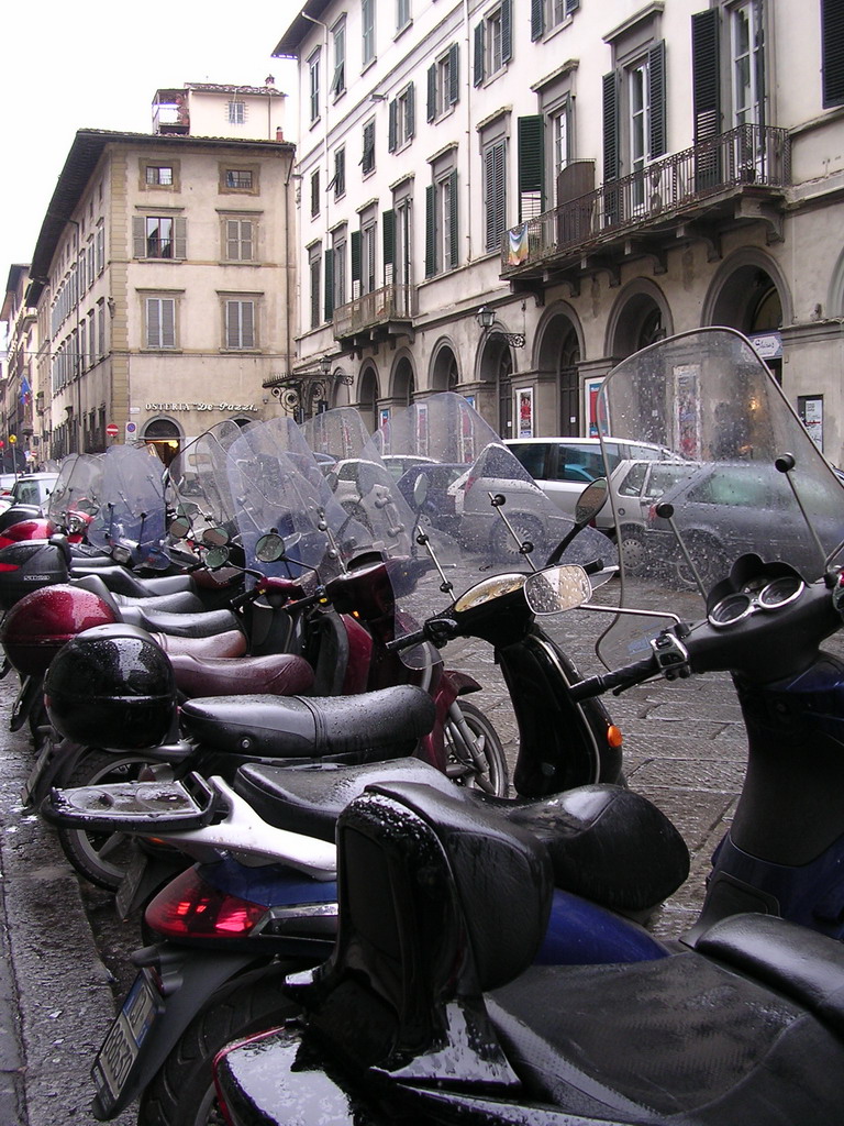 Scooters at the Via Giuseppe Verdi street