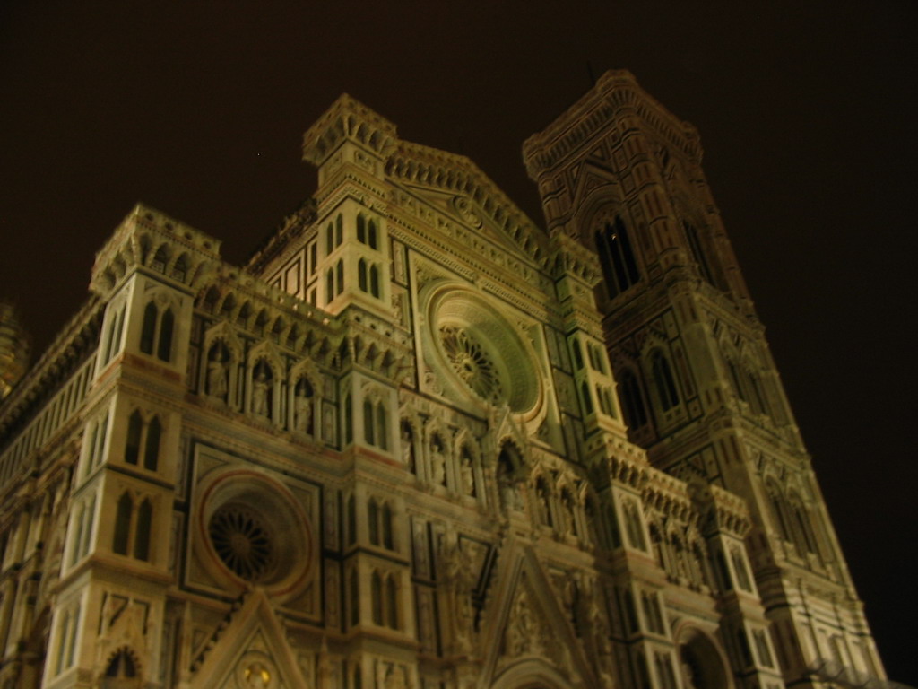 Facade of the Cathedral of Santa Maria del Fiore and the Campanile di Giotto tower, viewed from the Piazza del Duomo square, by night