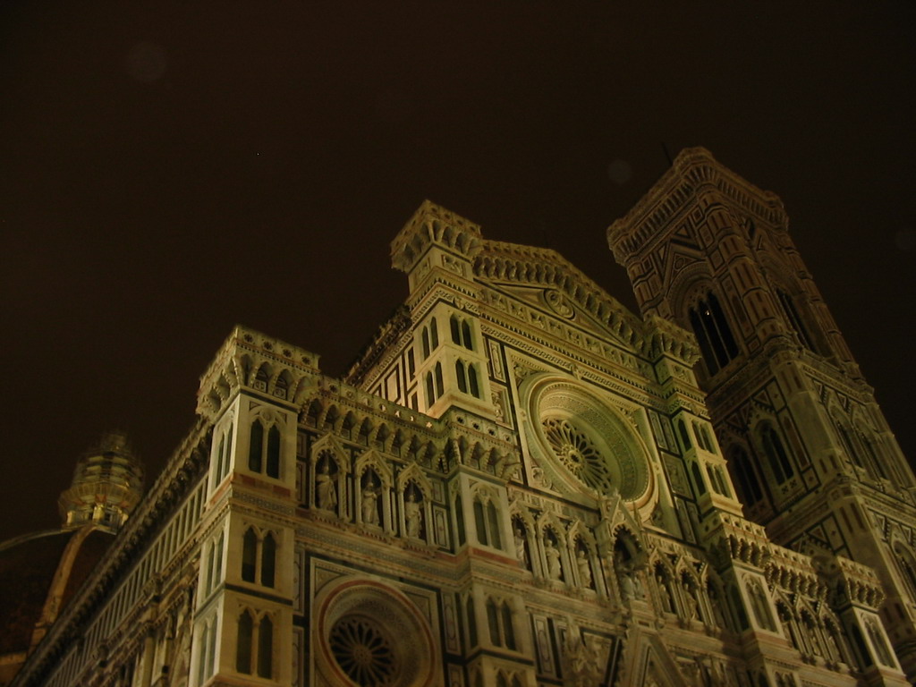 Facade of the Cathedral of Santa Maria del Fiore and the Campanile di Giotto tower, viewed from the Piazza del Duomo square, by night
