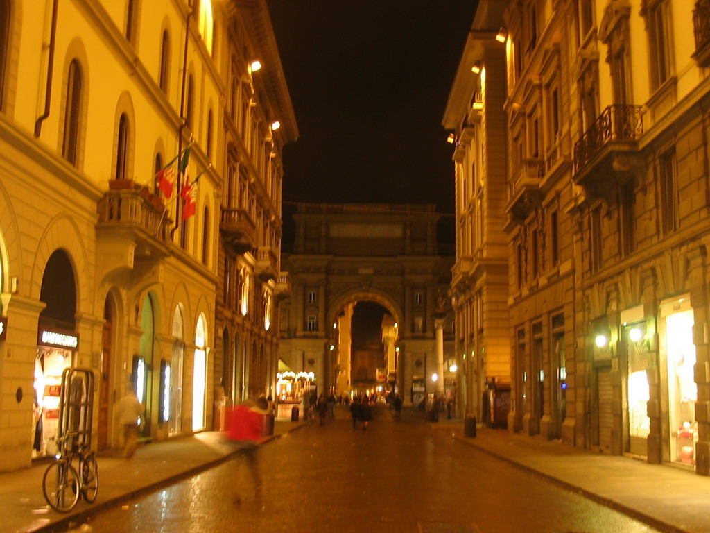 The Via degli Speziali street and the Piazza della Repubblica square, by night
