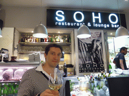 Tim with a glass of wine at the Soho restaurant at the Via Al Ponte Calvi street