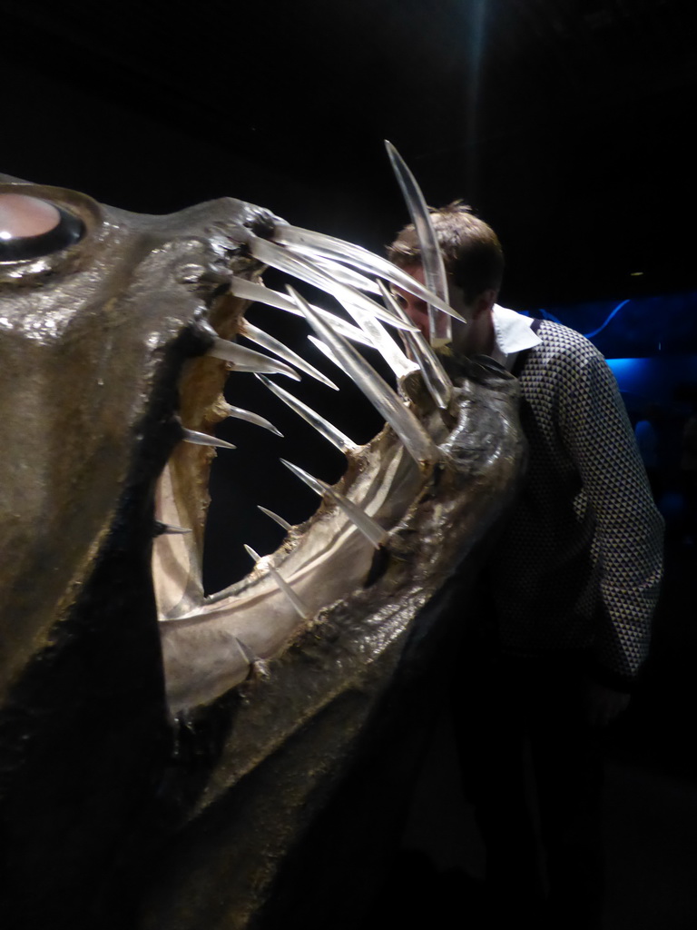 Tim with a fish statue at the Aquarium of Genoa