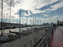 The Lighthouse of Genoa and boats in the Old Harbour, viewed from the Aquarium of Genoa