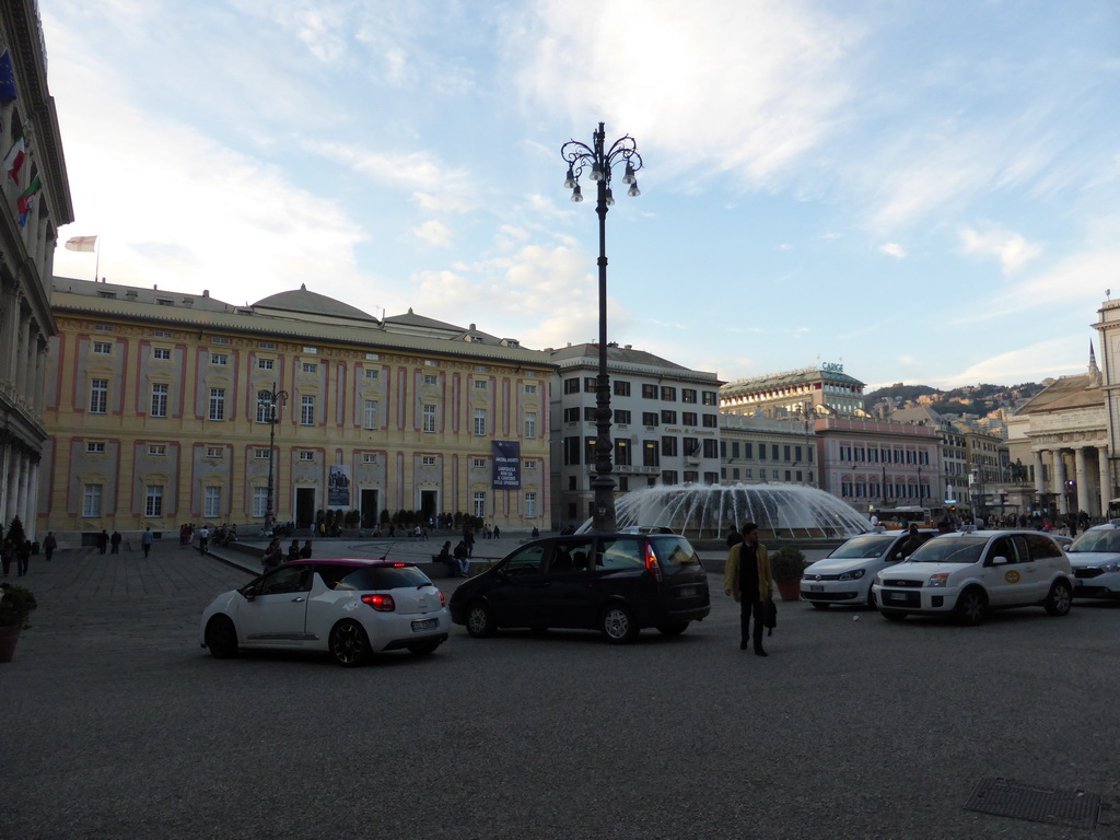 The Piazza de Ferrari square with a fountain and the Carlo Felice Opera Theatre