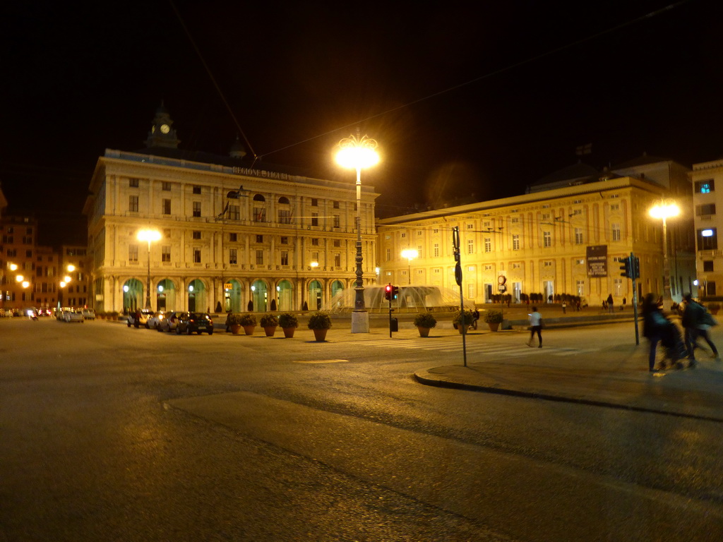 The Piazza de Ferrari square with a fountain, by night