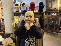 Miaomiao with a forage cap in the souvenir shop of Hotel Geysir