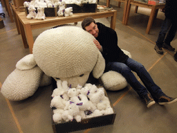 Tim with a stuffed animal in the souvenir shop of Hotel Geysir