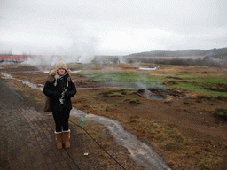 Miaomiao with the Litli Strokkur geyser at the Geysir geothermal area