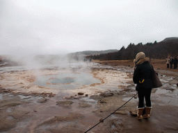 Miaomiao with the Strokkur geyser at the Geysir geothermal area