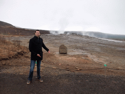 Tim with the Geysir geyser at the Geysir geothermal area