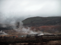 Several geysers at the Geysir geothermal area, viewed from the car from Gullfoss to Reykjavik