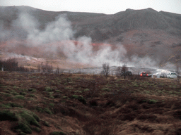 Several geysers at the Geysir geothermal area, viewed from the car from Gullfoss to Reykjavik