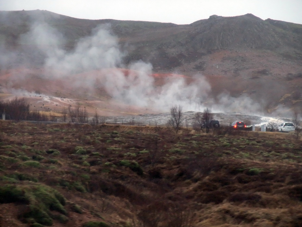 Several geysers at the Geysir geothermal area, viewed from the car from Gullfoss to Reykjavik
