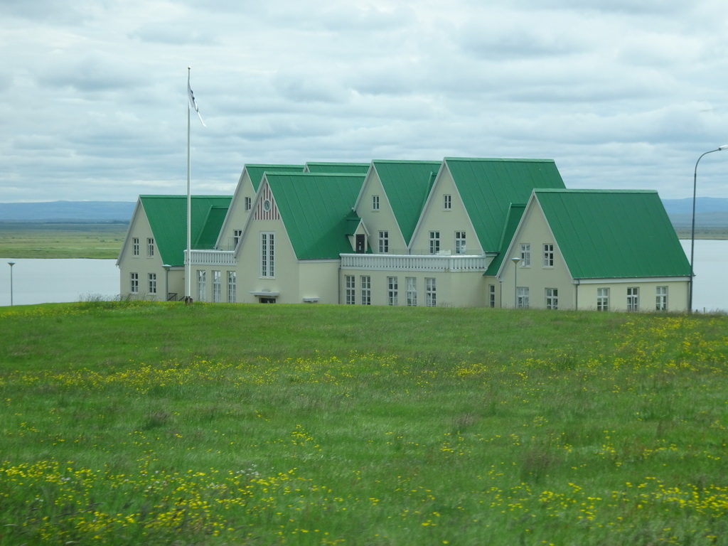 The Héraðsskólinn Boutique Hostel at the Laugarvatn lake, viewed from the rental car on the Laugarvatnsvegur road